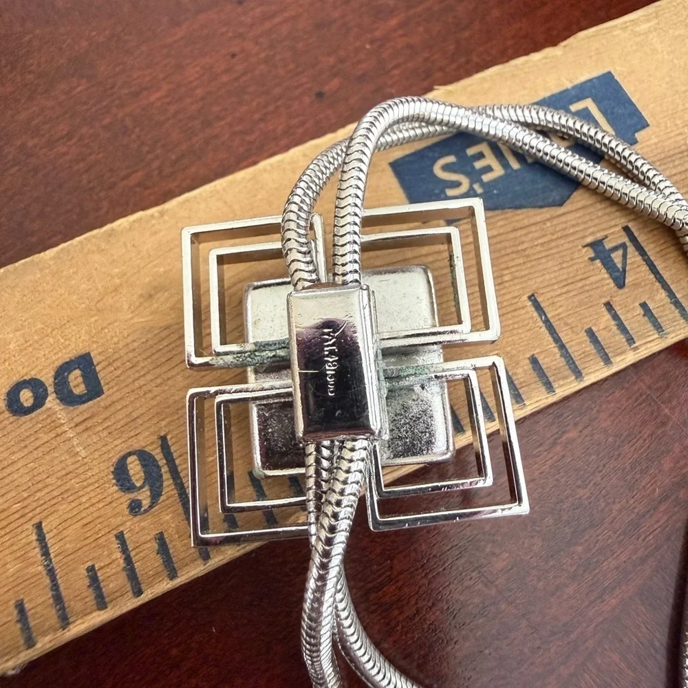 Pat Silver Tone Necklace